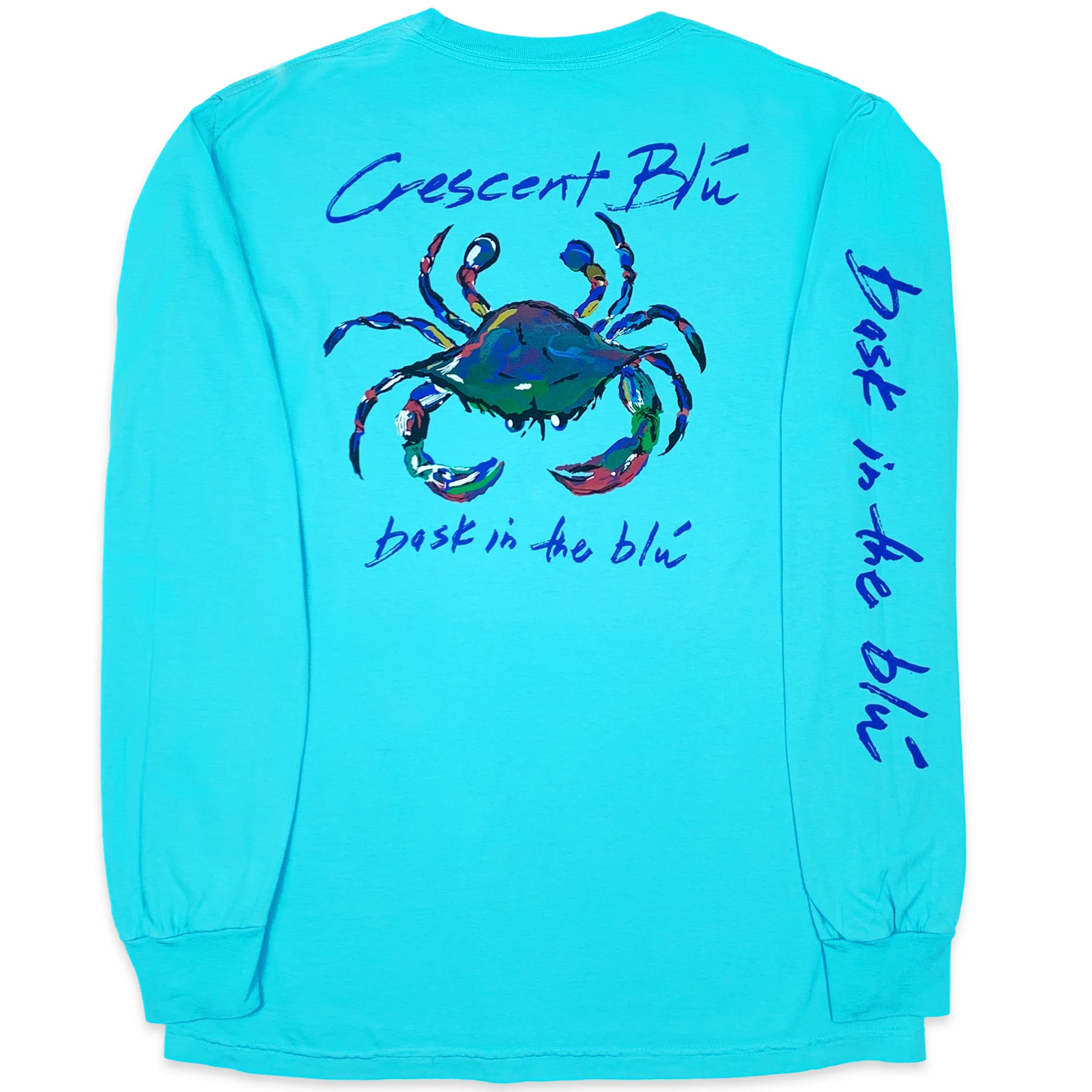 Back of a lagoon blue long sleeve Crescent Blu t-shirt with large multi-colored crab on the back and Bask in the Blu written on the right sleeve.