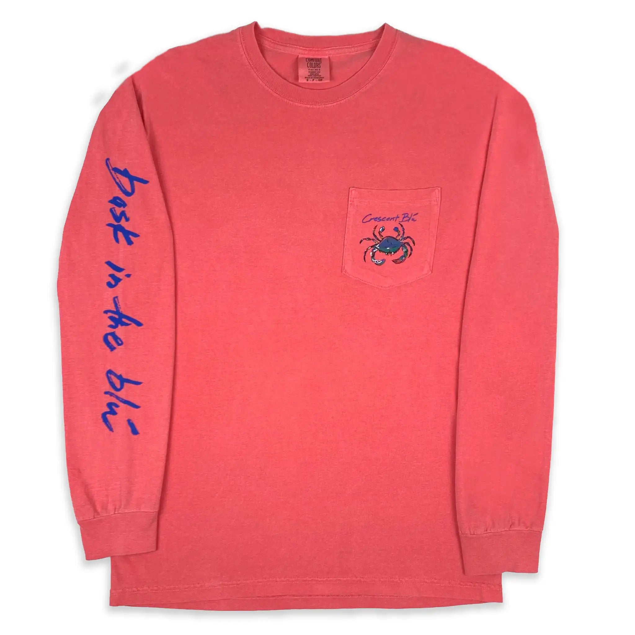A long sleeve with pocket tee with a crab printed on the left chest and Bask in the Blu printed on of the right sleeve.
