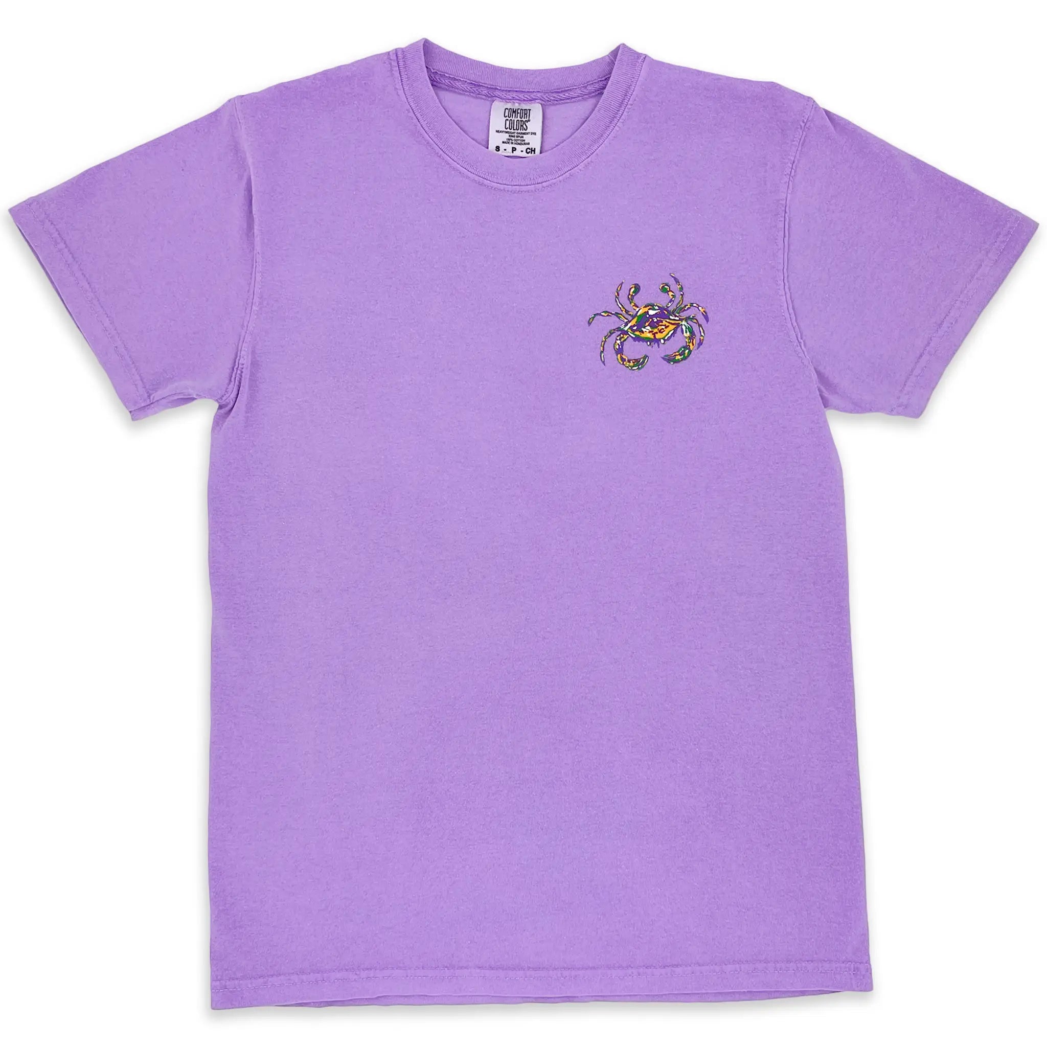 Mardi Gras Crab on the left upper chest of a violet adult short sleeve t-shirt.