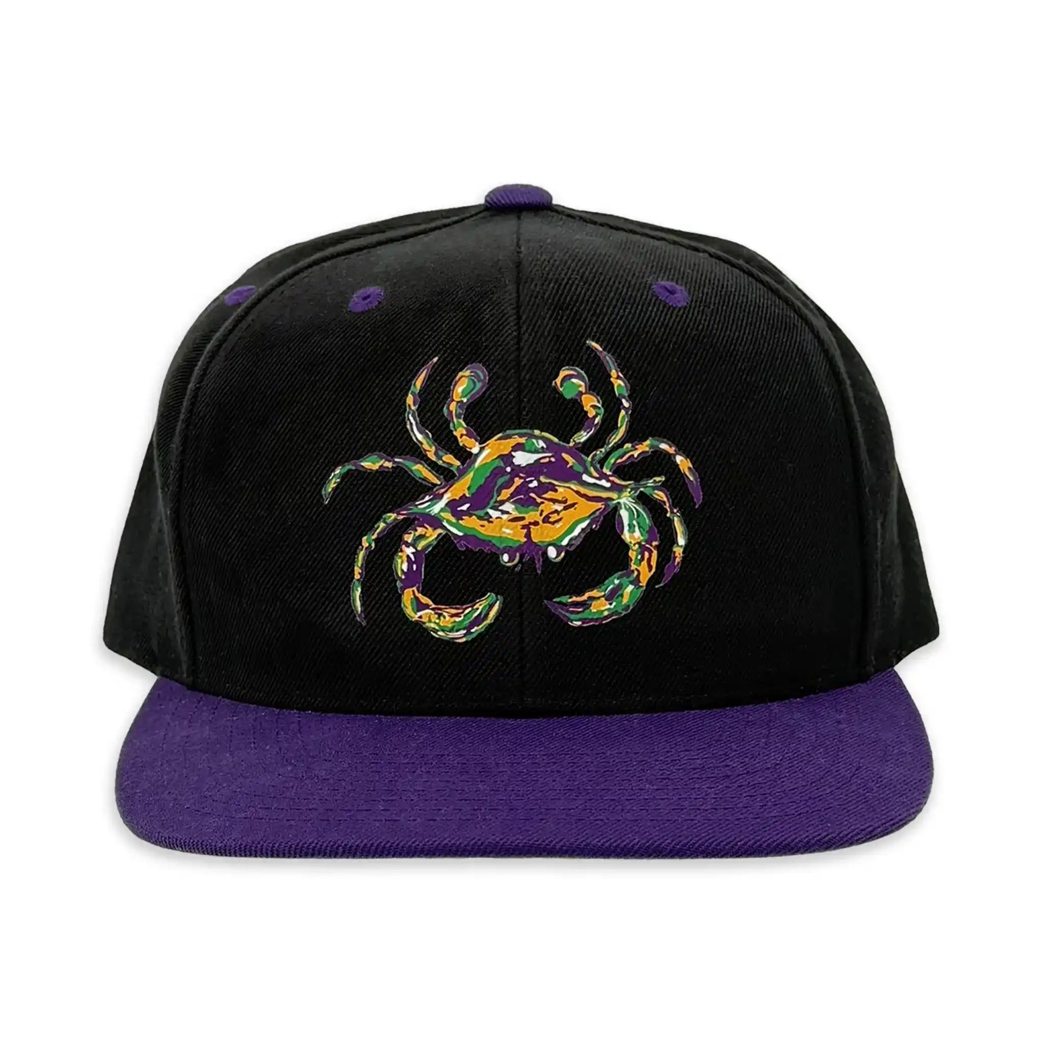 Front view of Crescent Blú flat bill hat with Mardi Gras crab design on black panel and purple bill