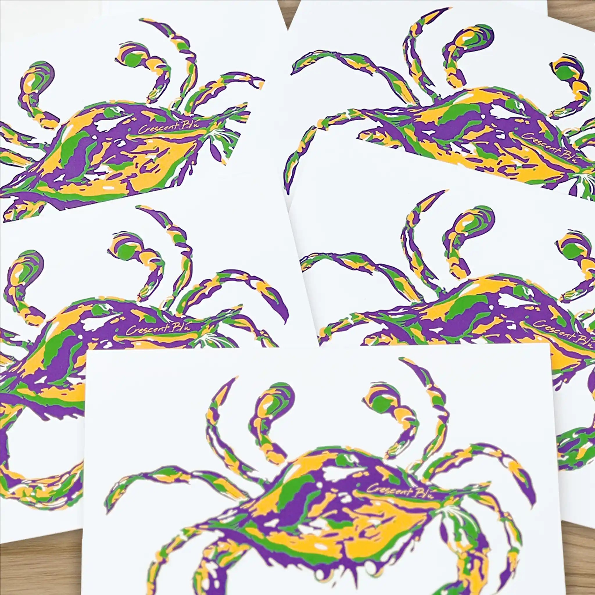 A pile of Crescent Blu Mardi Gras Crab notecards.