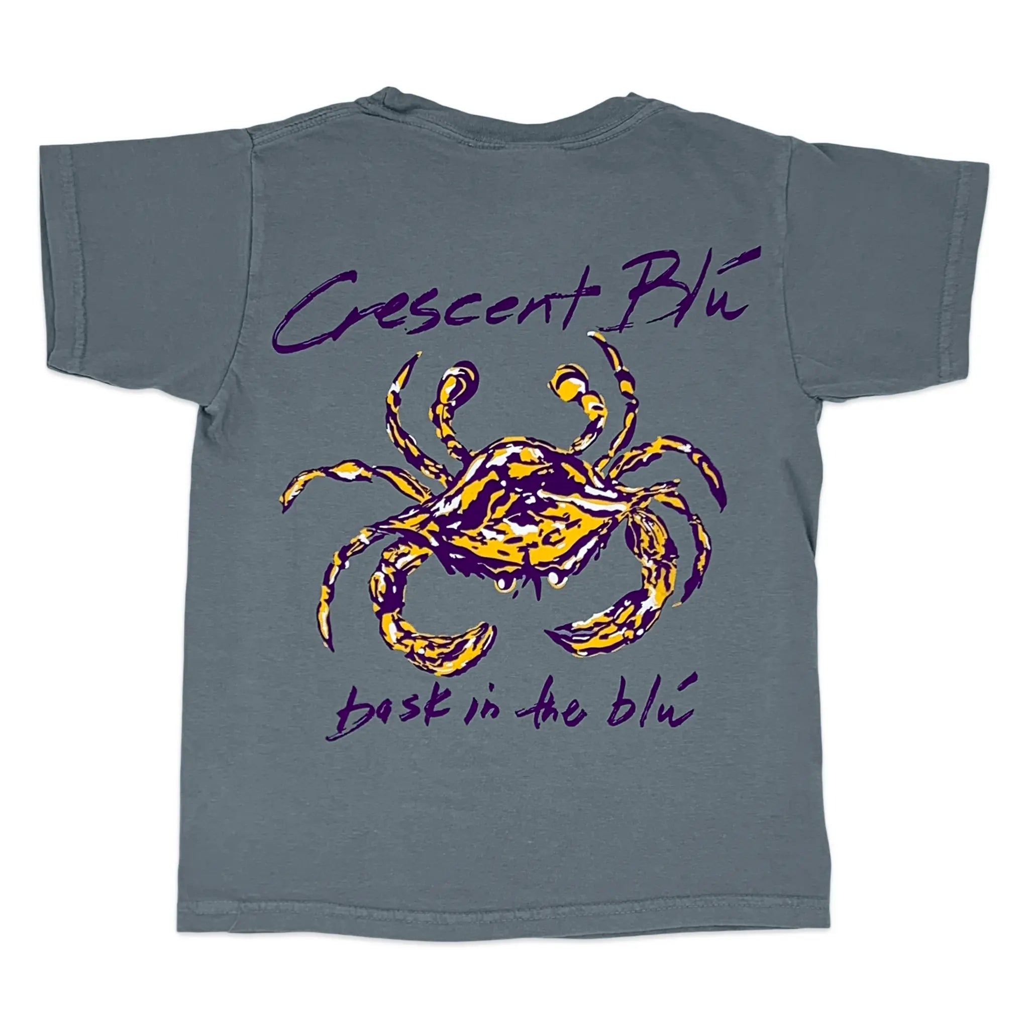 A gray short-sleeve t-shirt with a graphic print of a purple and gold crab in the center, with the words 'Crescent Blu and 'bask in the blue' written in purple