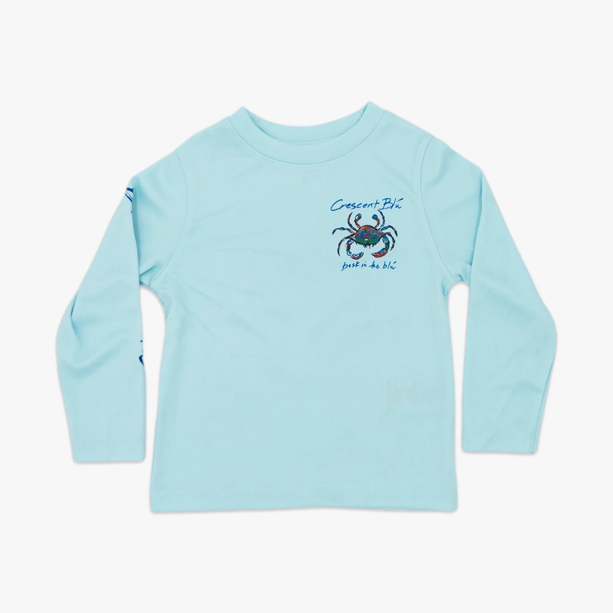 The front of an aqua blue toddler long sleeve sun shirt with the Crescent Blu signature crab logo on the left chest.