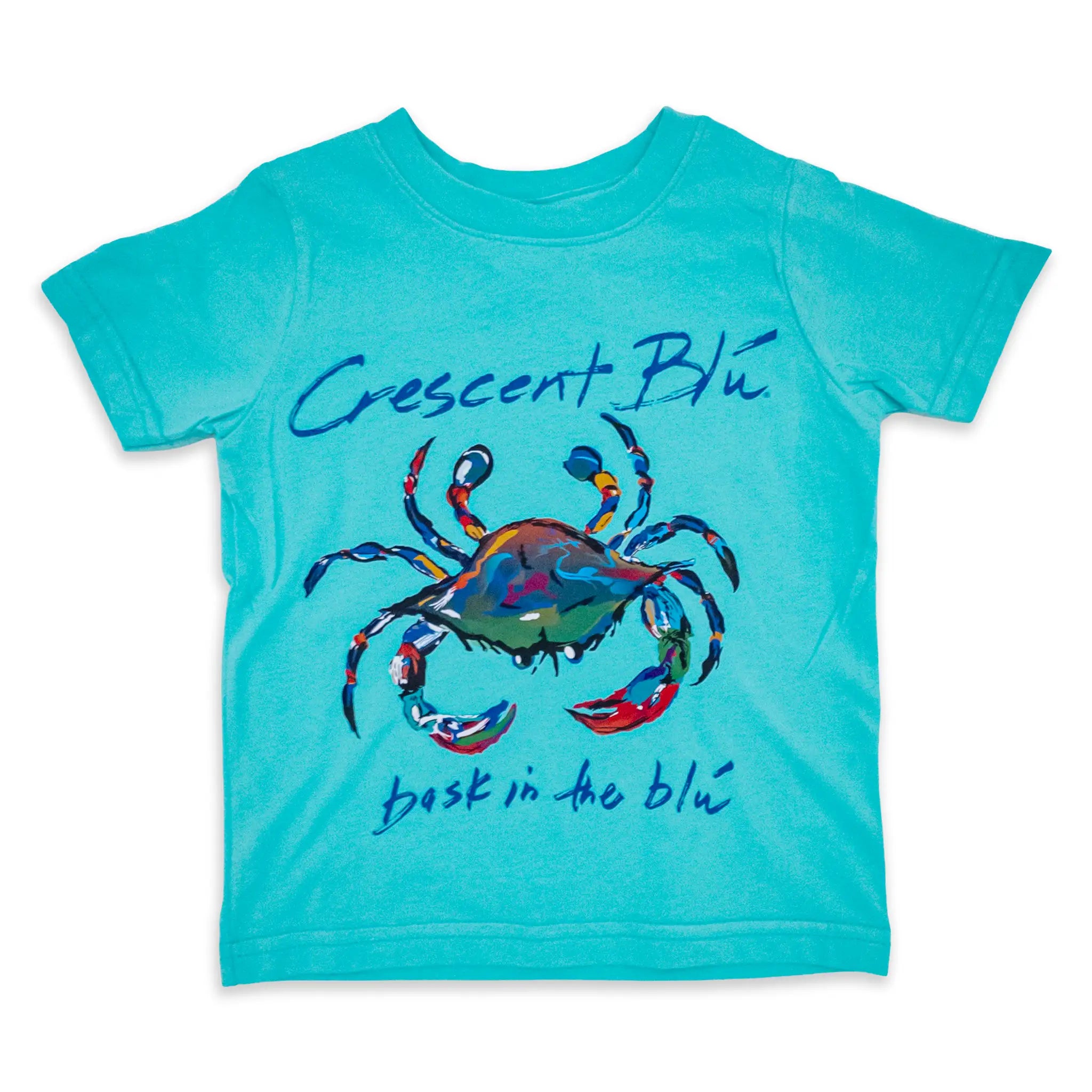 The front of a turquoise toddler  t-shirt with a colorful crab design and 'Crescent Blu' and 'bask in the blu' text above and below the crab