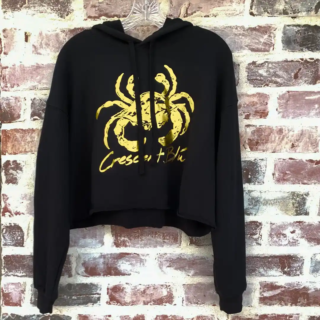 Front view of Crescent Blú Black & Gold Metallic Saints Crab crop hoodie
