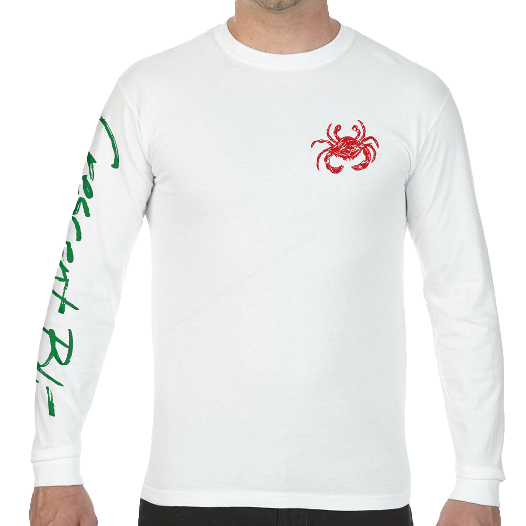 A man is wearing a with shirt with a red crab on the front and written in green on the right sleeve are the words, "Crescent Blú".