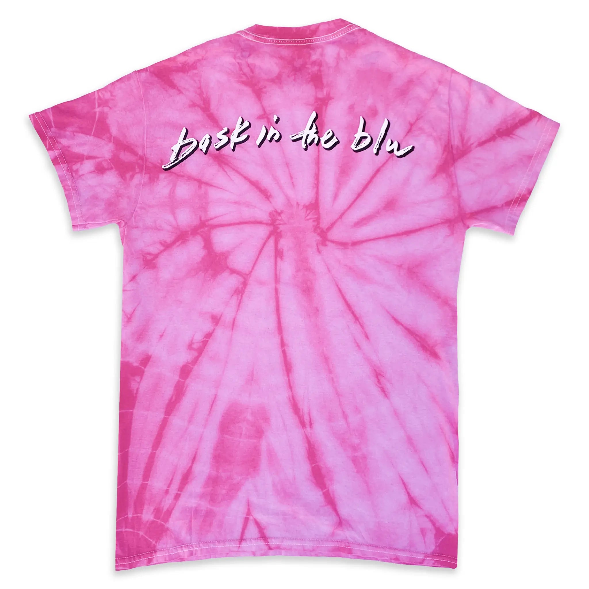 Pink tie-dye t-shirt with 'Bask in the blue' text on a white background