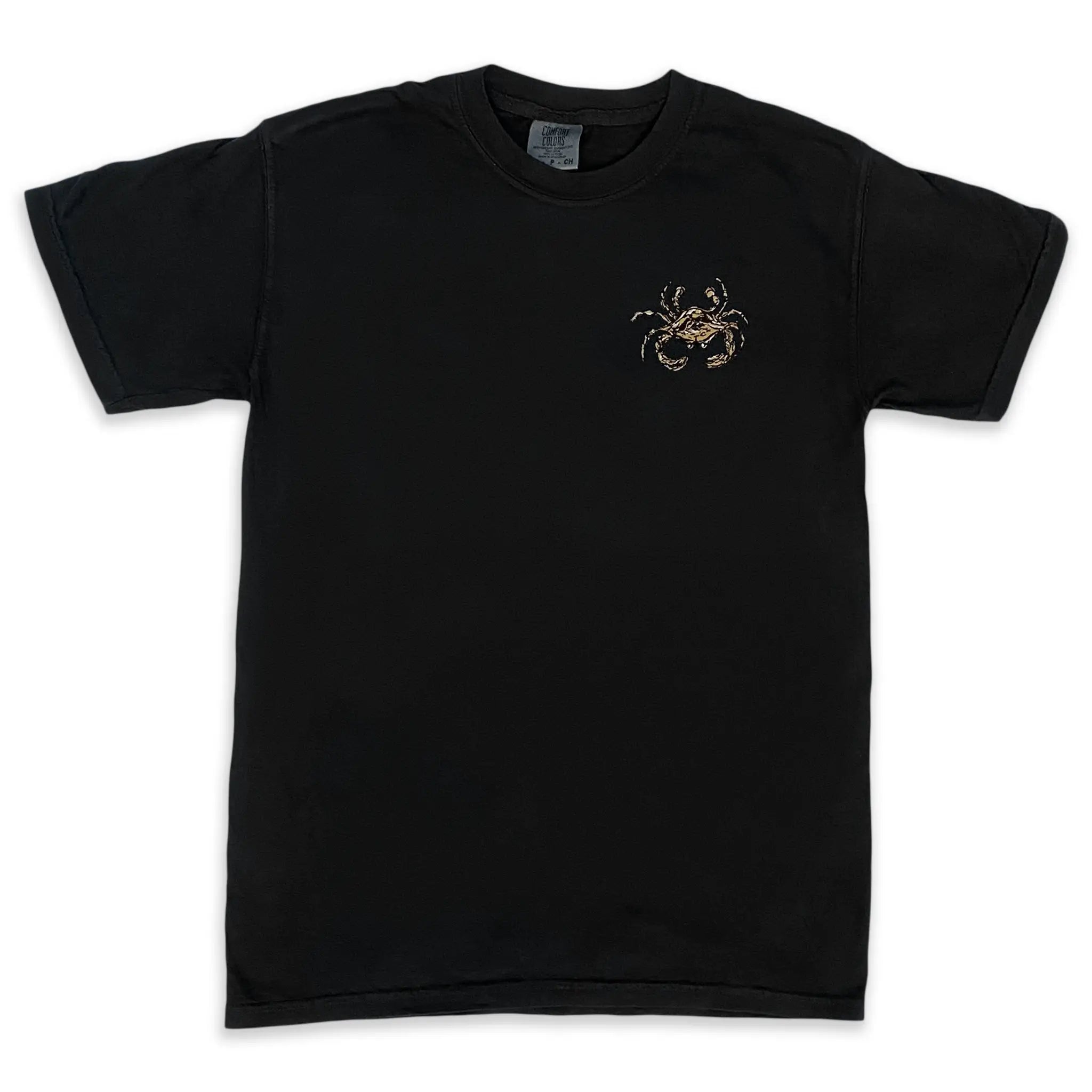 The front of a black short sleeve t-shirt with a black and gold saints crab on the left chest