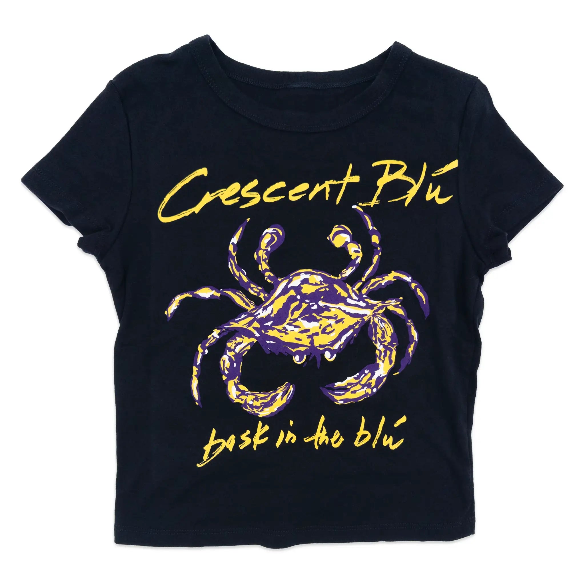 A black short-sleeve graphic T-shirt featuring a stylized purple and yellow crab in the center, with the words 'Crescent Blu' in yellow script above and 'bask in the blu' in yellow script below.