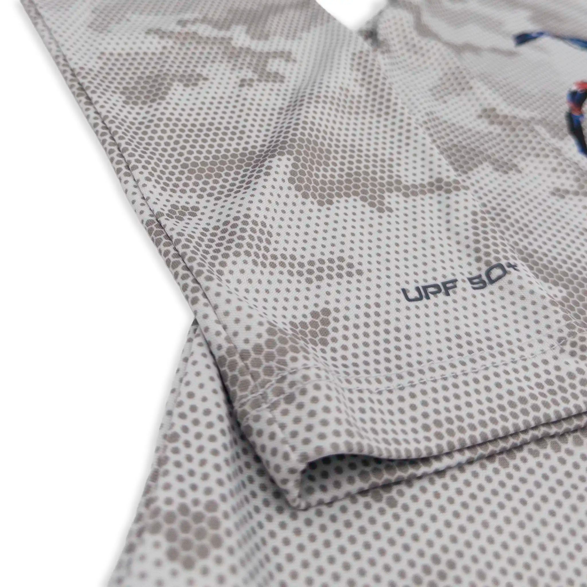 A zoomed in view of the sleeve of a UPF camouflage sun shirt.