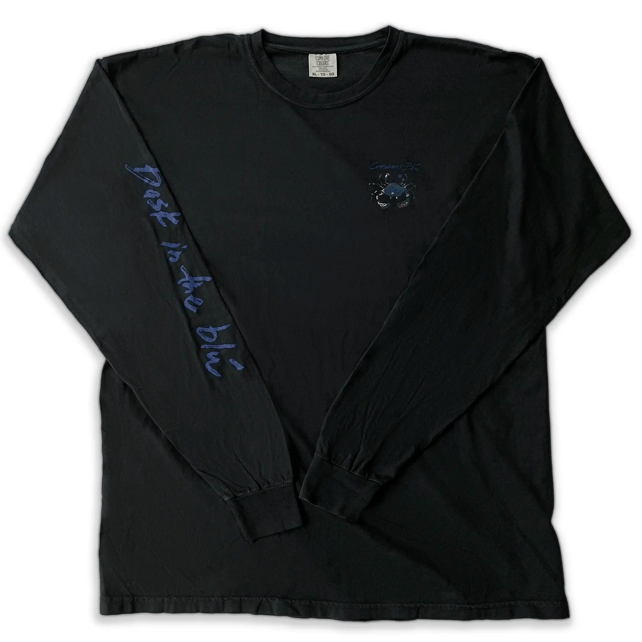 A black long sleeve t-shirt with, "Bask in the Blu" on a sleeve and a small blue crab on the chest.