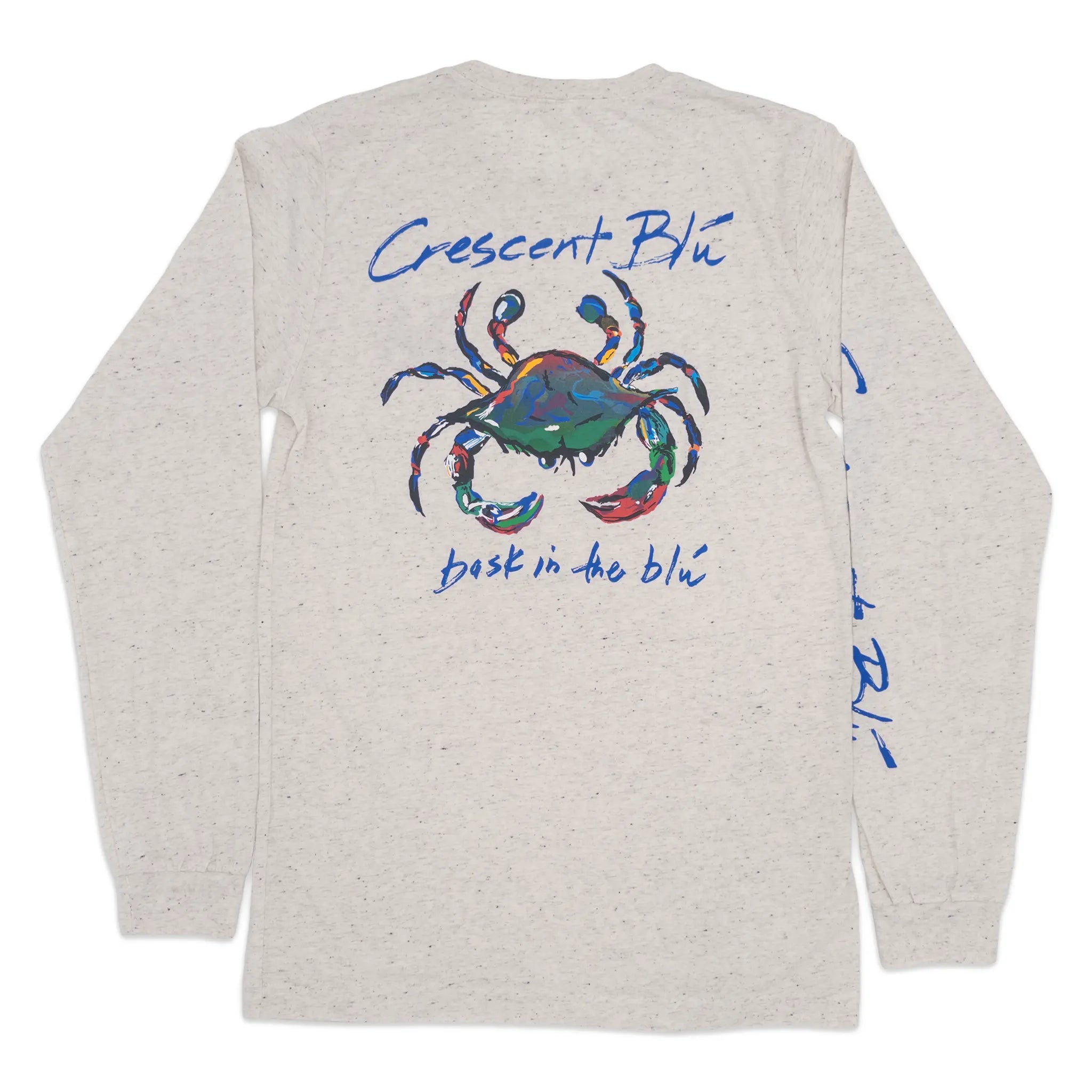 A light heather oatmeal long-sleeve t-shirt with a colorful crab graphic on the back with Crescent Blu and bask in the blu written in blue text above and below the crab