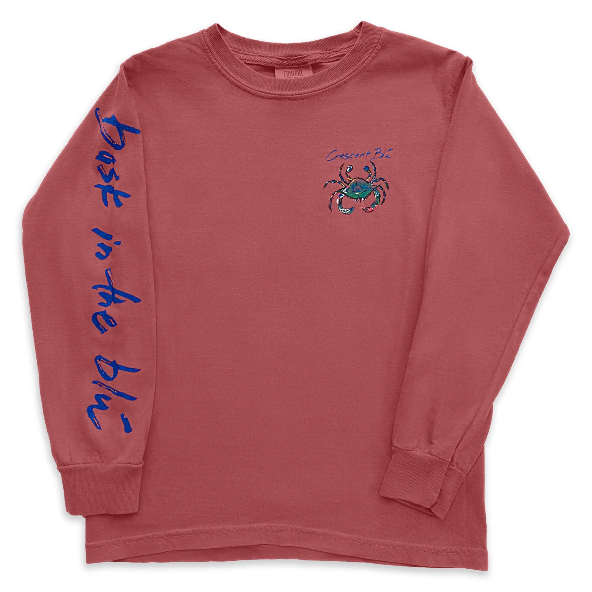 Front of a long sleeve youth crimson colors t-shirt with, "bask in the blu" written on one sleeve and the Crescent Blu crab logo on the front let chest.