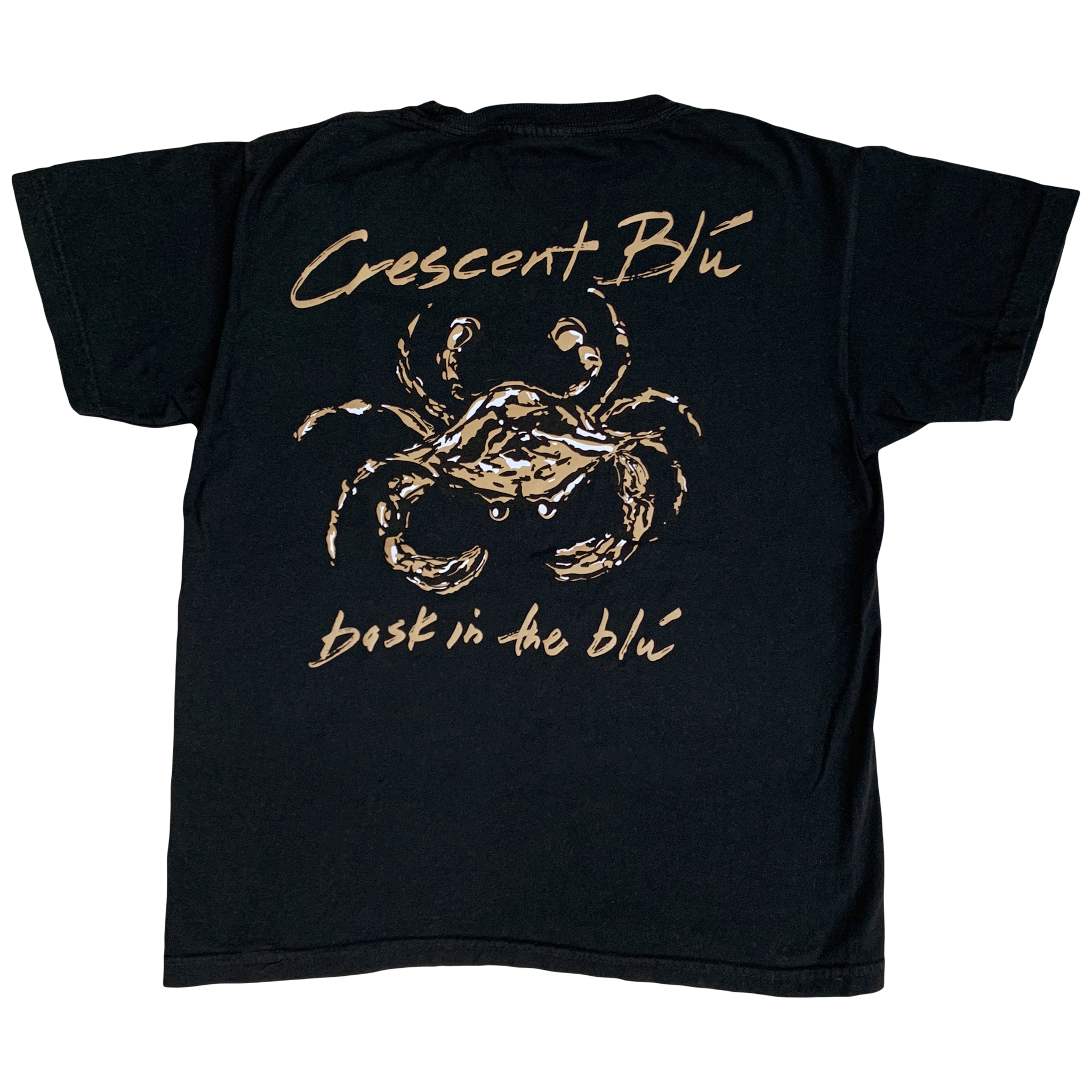 A black, gold, and white crab centered on the back of a black cotton youth short sleeve t-shirt. Written in gold above the crab is Crescent Blu, below the crab is bask in the blu written in gold.