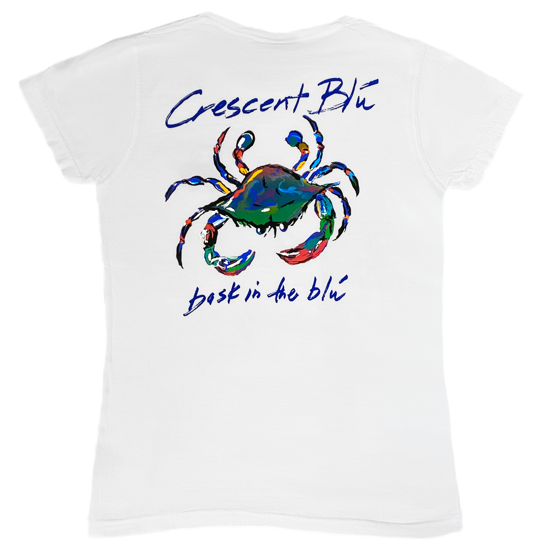 View of Back of white Ladies Cut short sleeve V-neck Tee with large iconic multi-colored Crescent Blu crab and Bask in the Blu tagline printed on the back