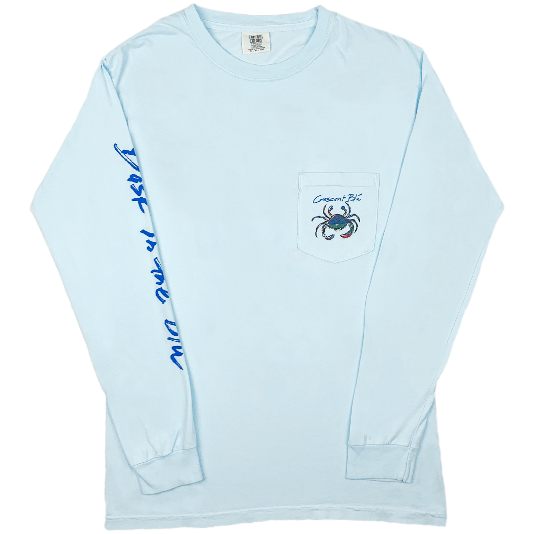 Adult t-shirt, long sleeve, chambray in color, with multi-colored crab logo on the left upper chest on pcoket. 